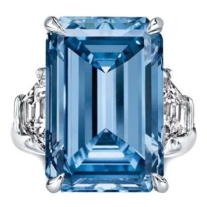 Three Stone Emerald Cut Blue Topaz Engagement Ring