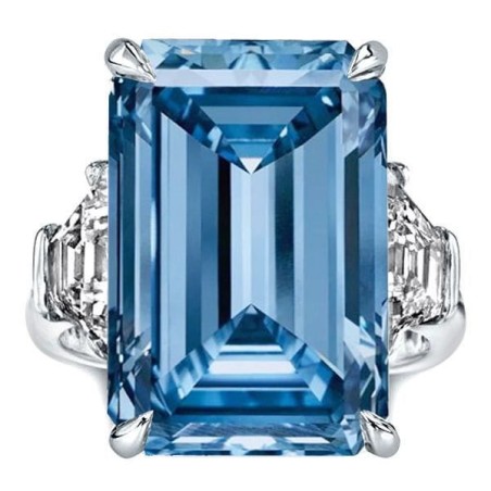 Three Stone Emerald Cut Blue Topaz Engagement Ring