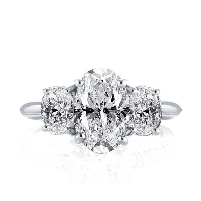 Three Stone Oval Created White Sapphire Engagement Ring