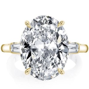 Golden Oval Three Stone Engagement Ring